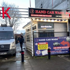 Hand Car Wash shopfront in West London featuring illuminated signage and special offers for car washing services by Sign4U